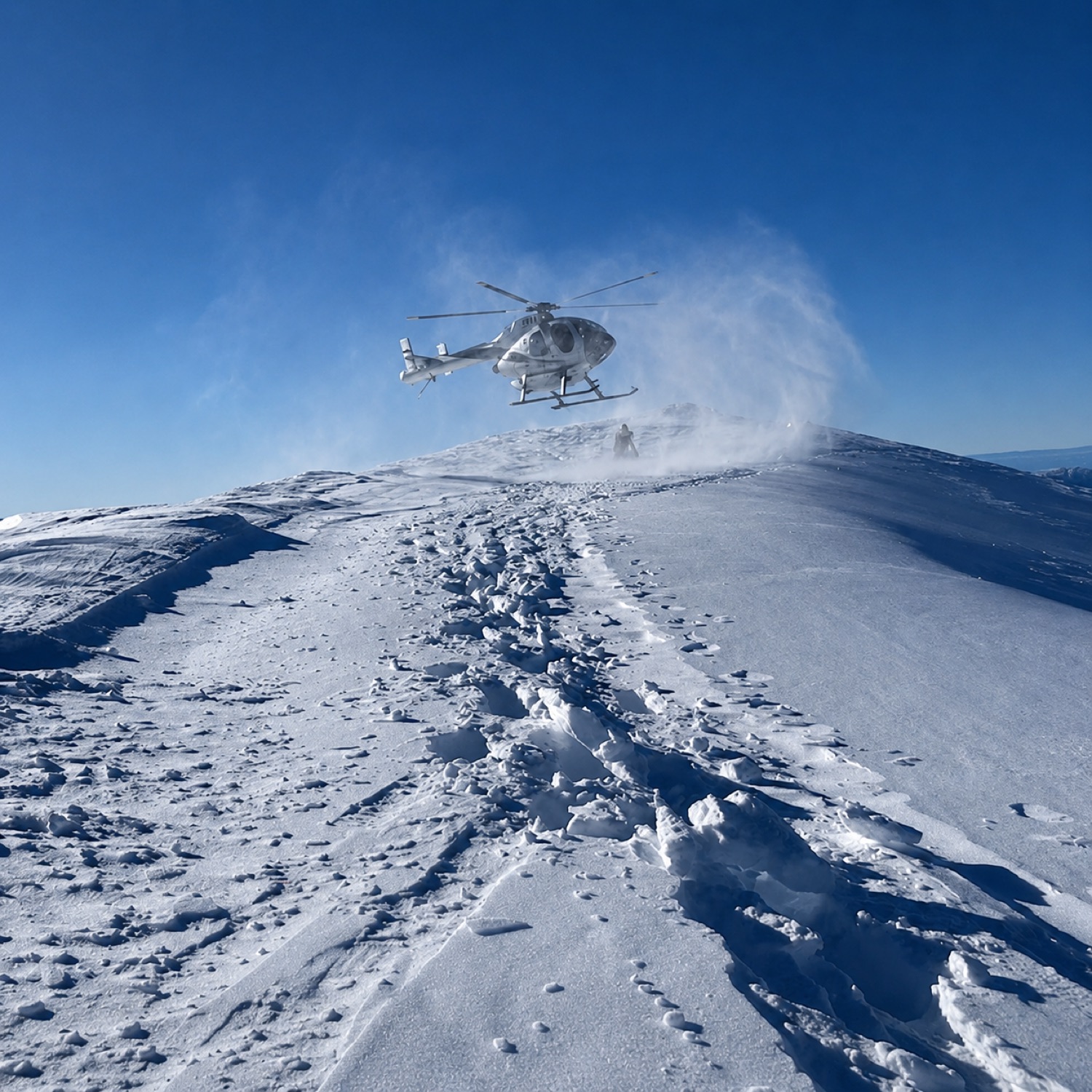 Snow-capped summit above the station